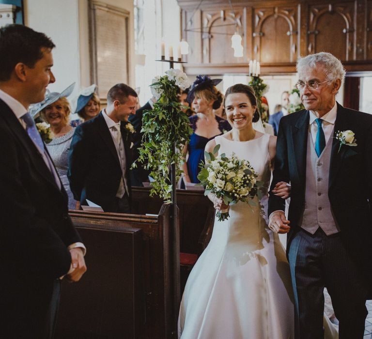 Church wedding ceremony bridal entrance in Pronovias wedding dress