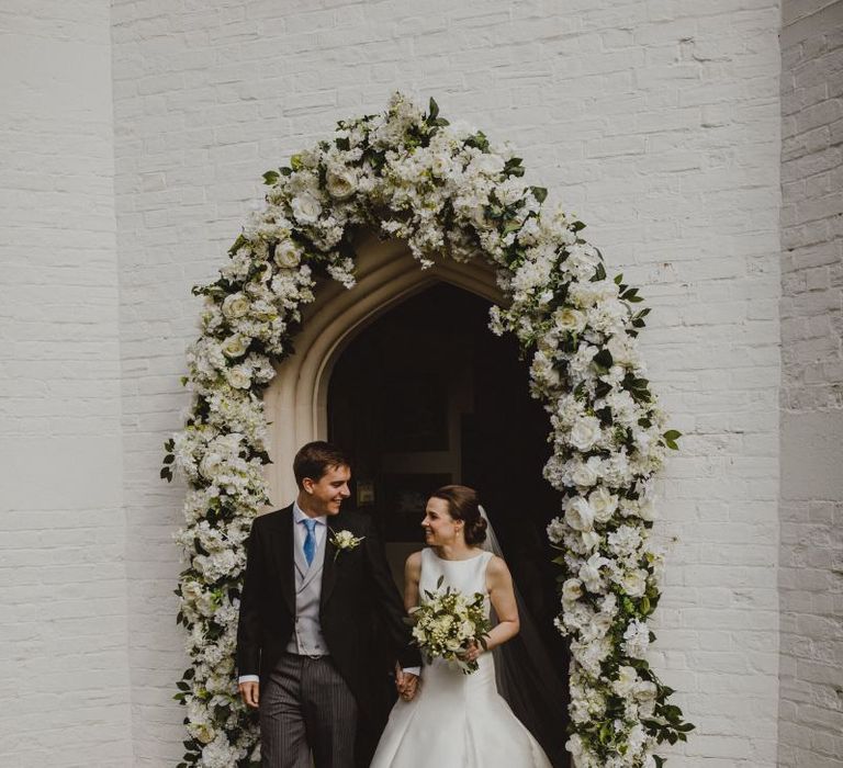 White and green church floral arch