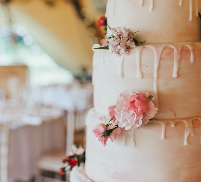 Pink wedding cake with flower decor