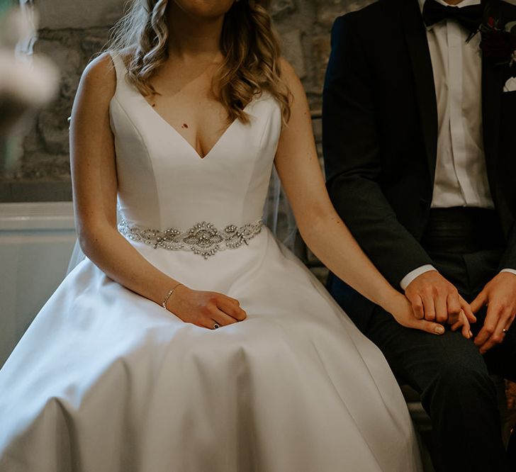 Satin wedding dress with embellished belt detail