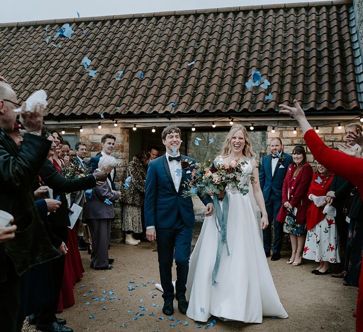 Confetti exit bride and groom