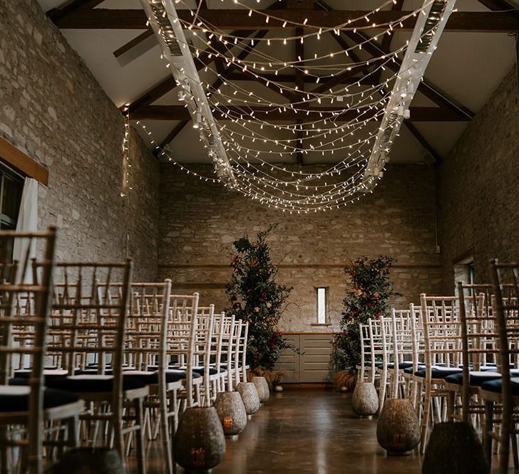 Fairy light canopy and unplugged wedding sign for ceremony