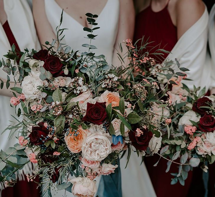 Winter wedding bouquet with pinks and red flowers