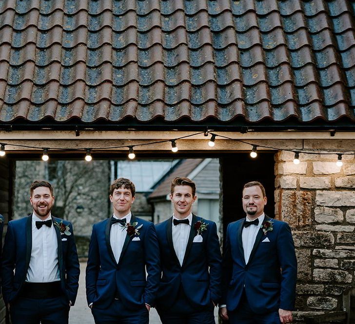 Groomsmen in matching tuxedos for December wedding in Bristol