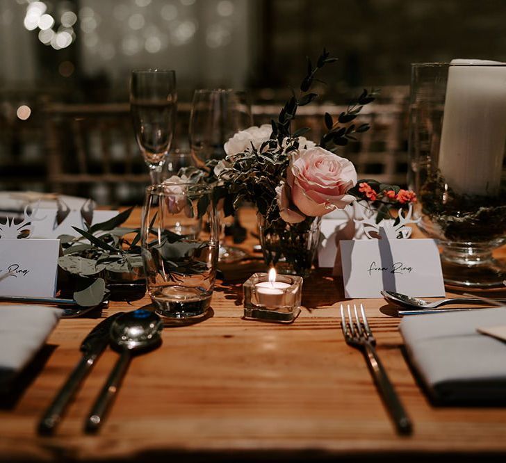 Wedding table decor with flowers and candles