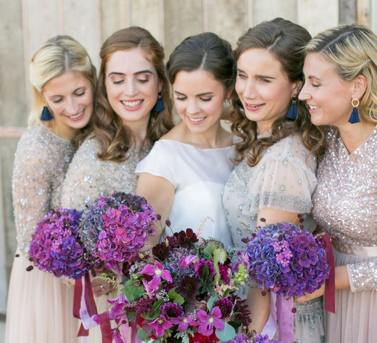 Bridal Party with Bridesmaids in Needle &amp; Thread Dresses,  Bride in Jesus Peiro Wedding Dress Holding Purple Hydrangea Bouquets