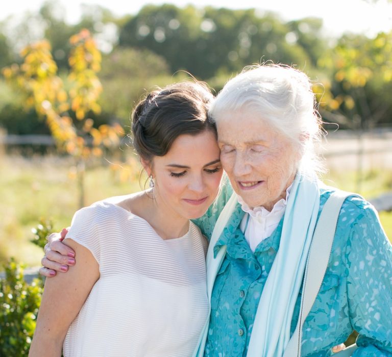 Bride in Jesus Peiro Wedding Dress Hugging Her  Grandmother