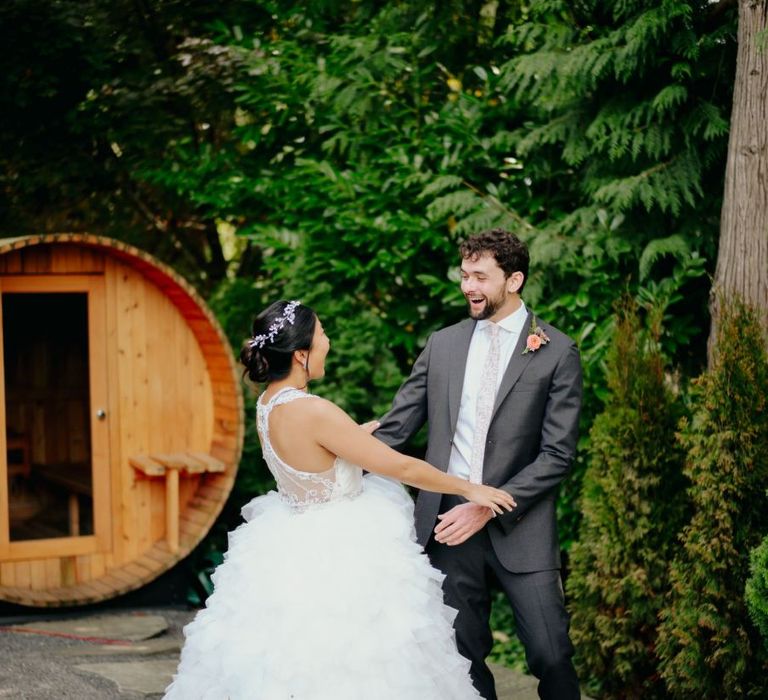 Bride in layered tulle skirt at first look