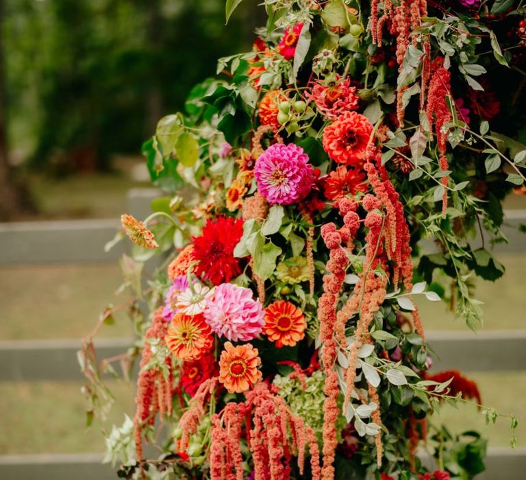 brightly coloured wedding arch flowers