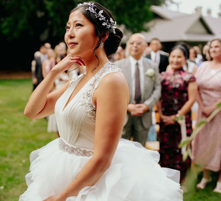 Bride in preloved wedding dress with layered skirt