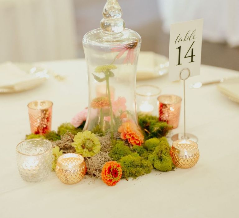 Moss centrepiece with apothecary jar and votives