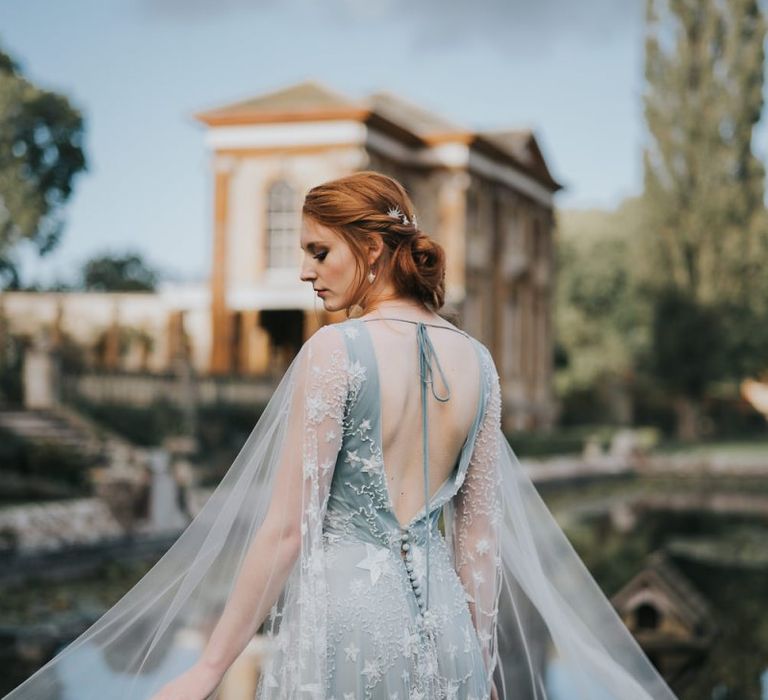 bride in blue celestial wedding dress with white embroidery