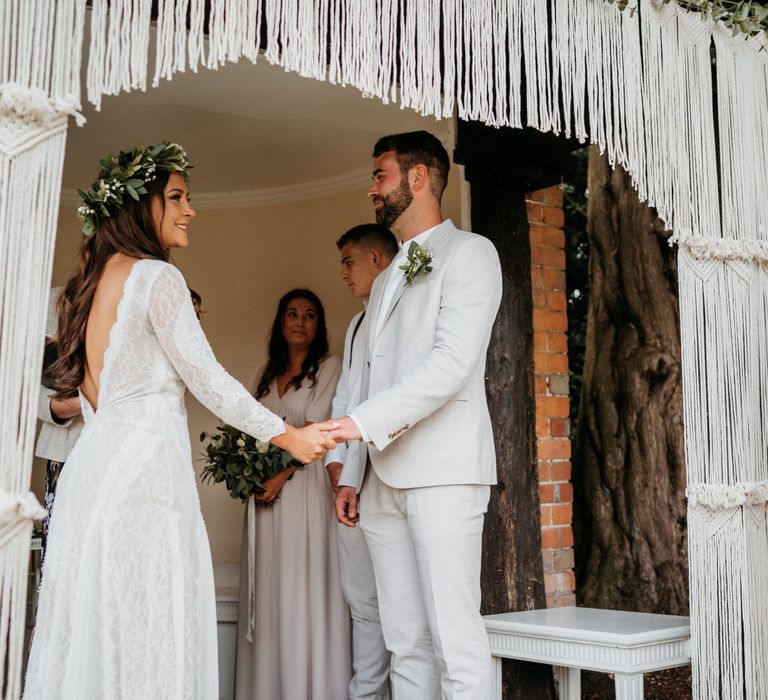 Macrame wedding decor at altar for outdoor ceremony