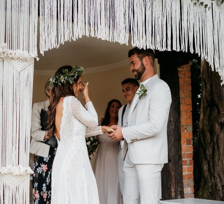 Macrame decor, donut wall and grazing table at outdoor wedding