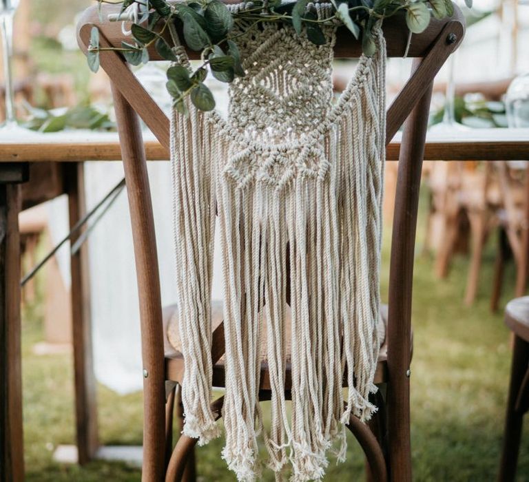 Macrame wedding chair back decor for outdoor wedding with donut wall