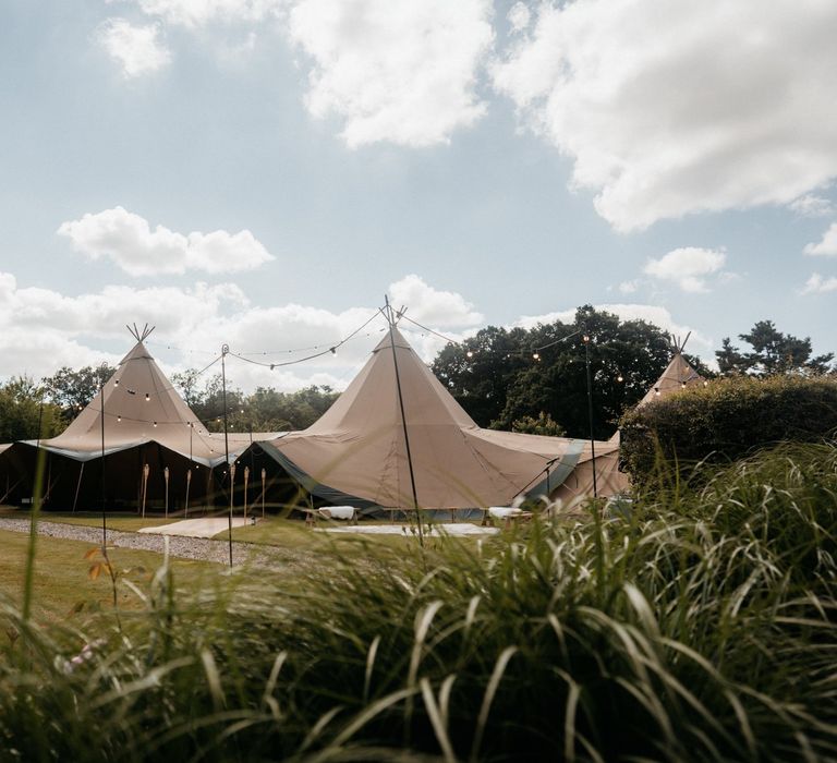 Tipi wedding with donut wall and grazing table