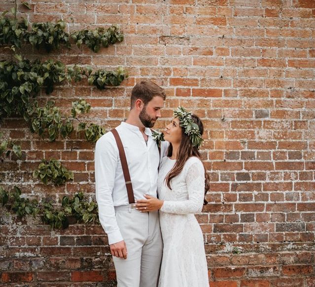 Long sleeved wedding dress with foliage crown at Secret Garden wedding in Berkshire