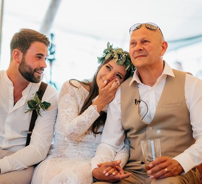 Bride and groom watch father's speech and get emotional