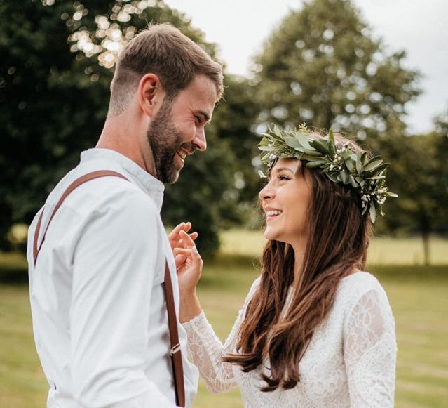 Bride wears foliage crown at outdoor wedding