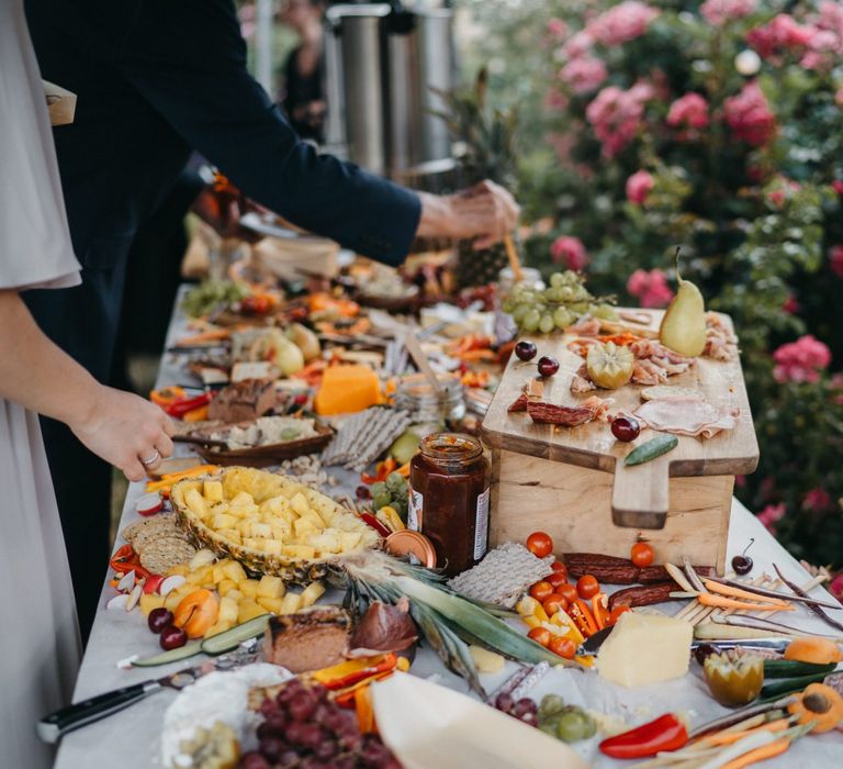 Grazing table and donut wall at outside wedding