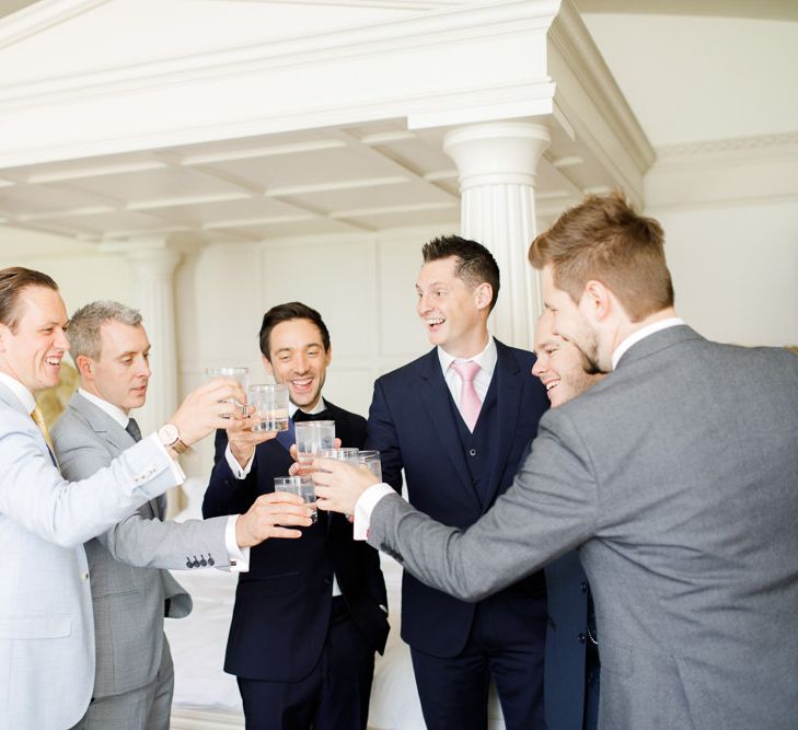 Groom toasts wedding with friends