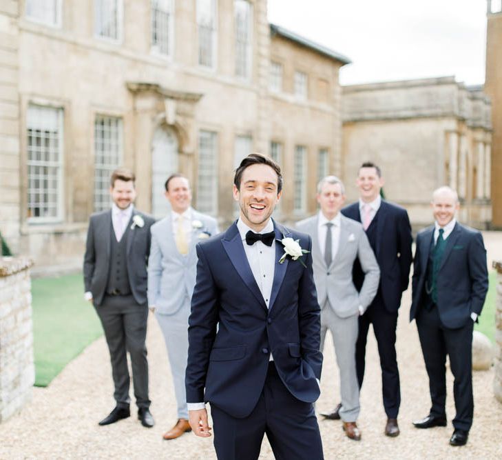 Groom and guests at Aynhoe Park for whimsical wedding