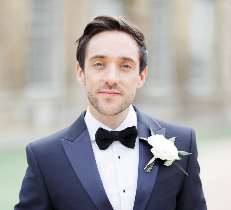 Groom in classic tuxedo with flower buttonhole