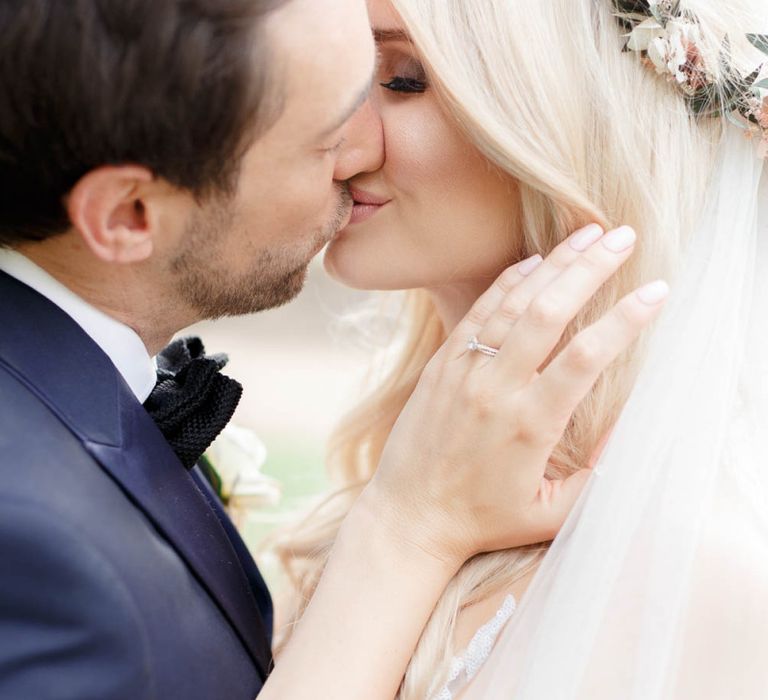 Bride and groom steal a kiss