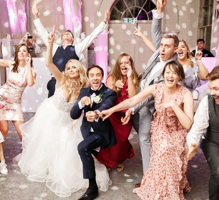 Bride and groom enjoy a dance with their friends and family