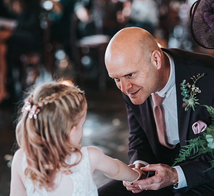 Father of the Bride and Flower Girl Talking During the Wedding Ceremony