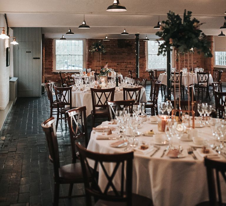 Copper Centrepiece Wedding Reception Decor at Industrial Venue The West Mill in Derbyshire