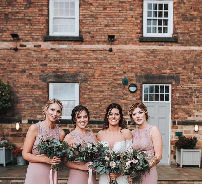 Bridal Party with Bridesmaids in Mauve TFNC Dresses and Bride in Lace Bardot Wedding Dress