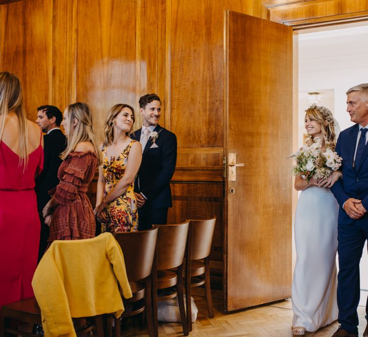 Wedding Ceremony Bridal Entrance  in Lace Off The Shoulder Jennifer Regan Wedding Dress and Flower Crown