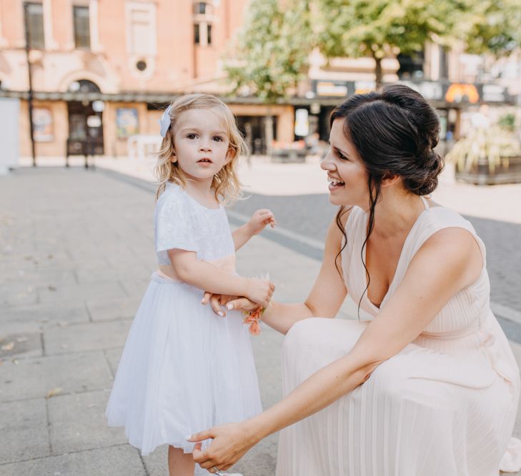 Bridesmaid in Peach Dress with Little Flower Girl