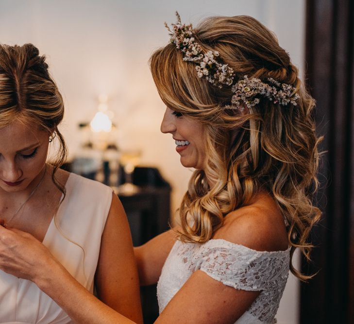 Bride in Lace Off The Shoulder Jennifer Regan Wedding Dress and Flower Crown  Giving Bridesmaids a Gift on the Wedding Morning