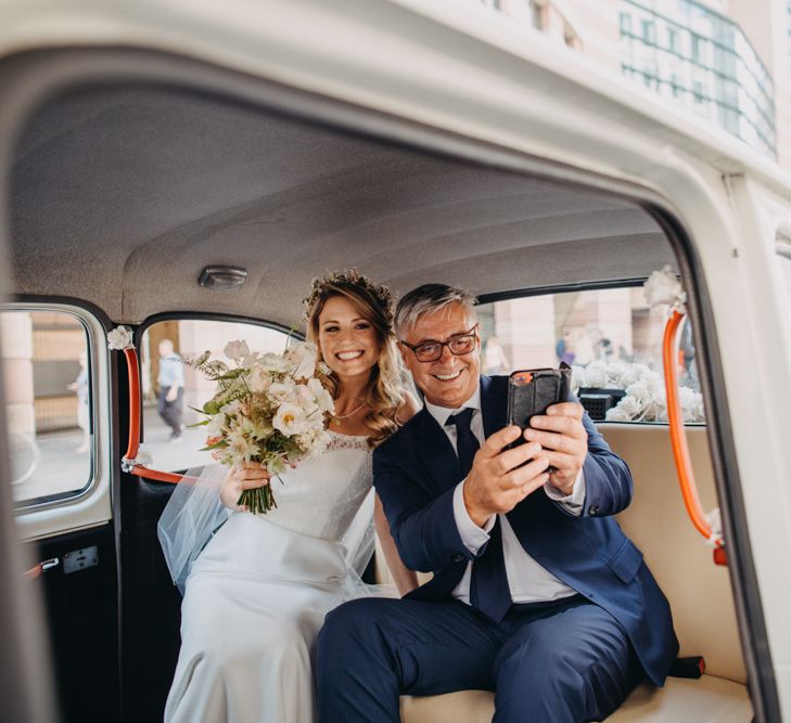 Selfie of Father of The Bride and Bride in Lace Off The Shoulder Jennifer Regan Wedding Dress and Flower Crown