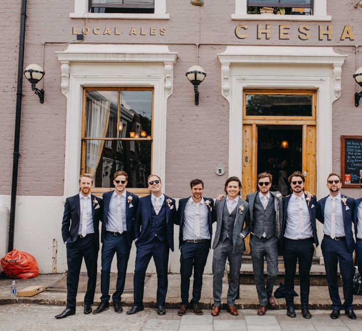 Groomsmen in Grey and Navy Suits Outside a London Pub