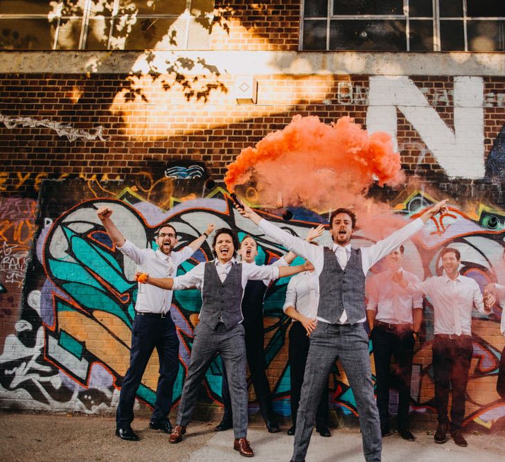 Groomsmen in Grey Suits Supply Suits with Orange Smoke Bombs