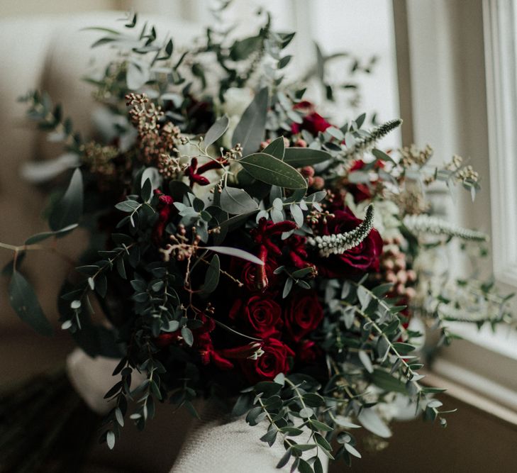 Winter Wedding Bouquet with Red Flowers and Foliage