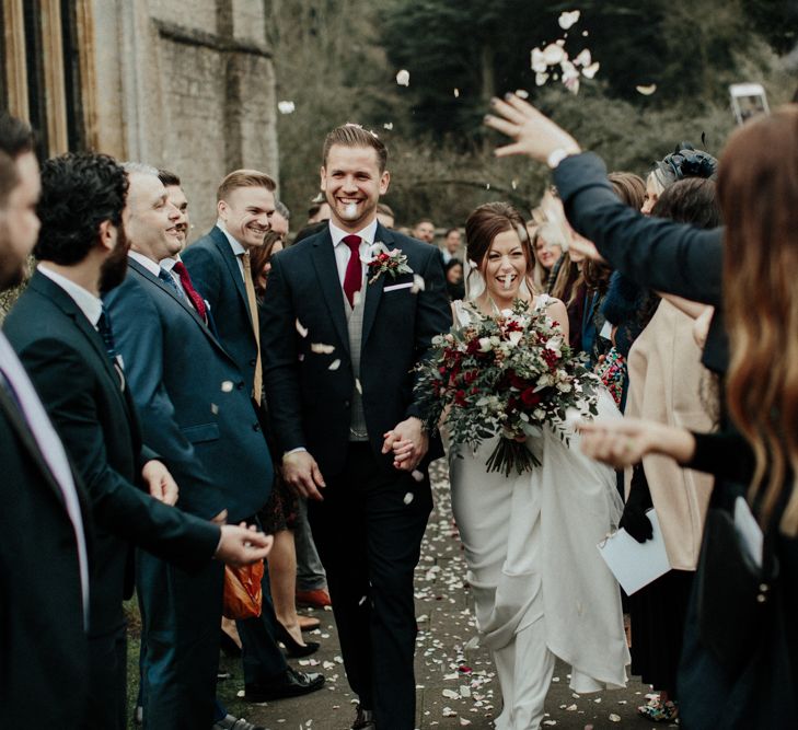 Confetti Moment with Bride in Essense of Australia Wedding Dress and Groom in Marks and Spencer Suit