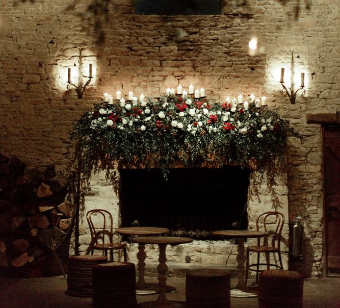 Foliage, Red Flowers and Candle Light Fireplace Arrangement