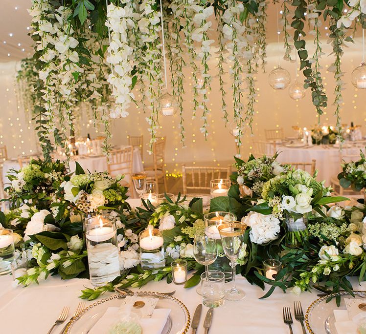 White Wedding Flowers and Foliage Table Decor with Candles