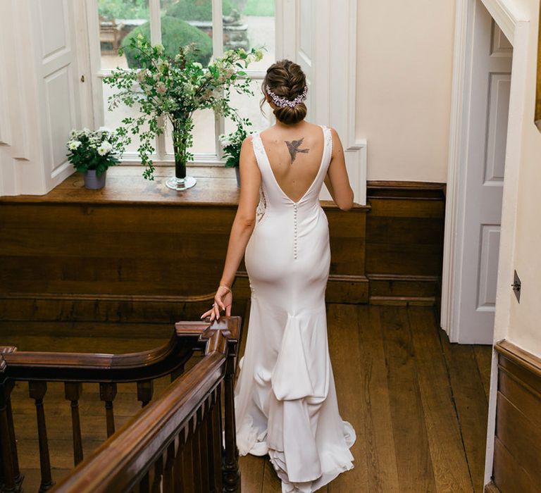 Bride in Fitted Pronovias Wedding Dress with Buttons Down the Back