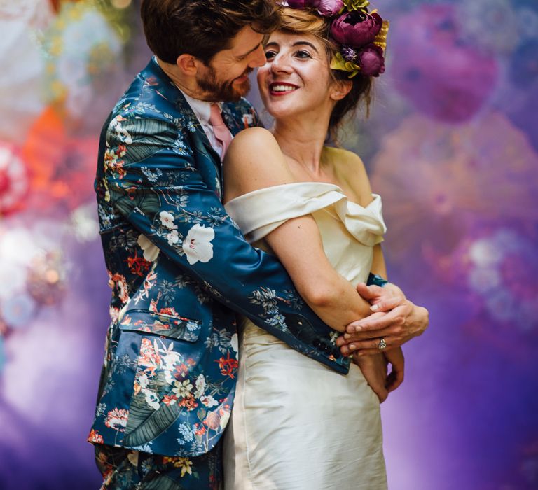 Colourful Parasol Photo Backdrop For Wedding // Secret Garden Party Inspired Wedding France Bride In Large Faux Floral Crown And Glitter Station With Groom In Floral Print Suit &amp; Images From The Shannons