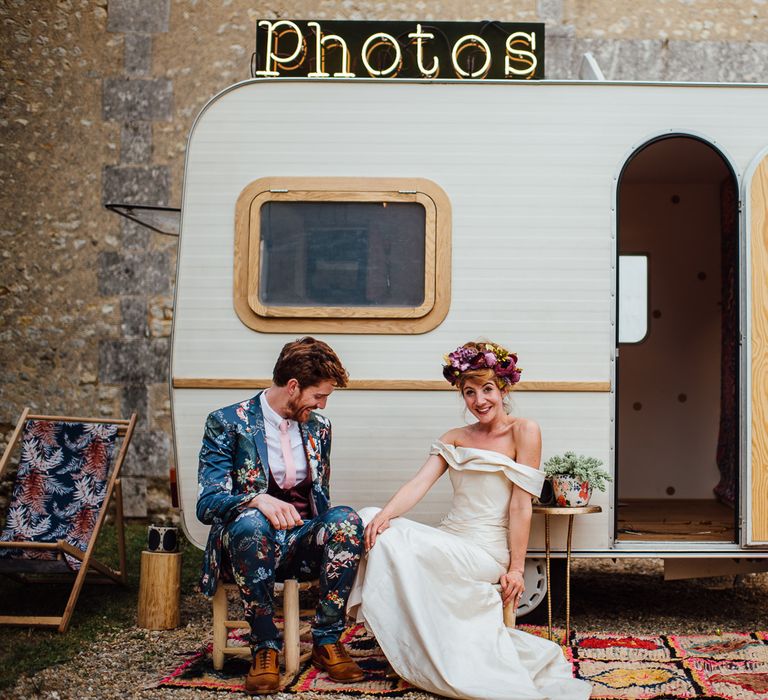 Caravan Photo Booth For Wedding // Secret Garden Party Inspired Wedding France Bride In Large Faux Floral Crown And Glitter Station With Groom In Floral Print Suit &amp; Images From The Shannons