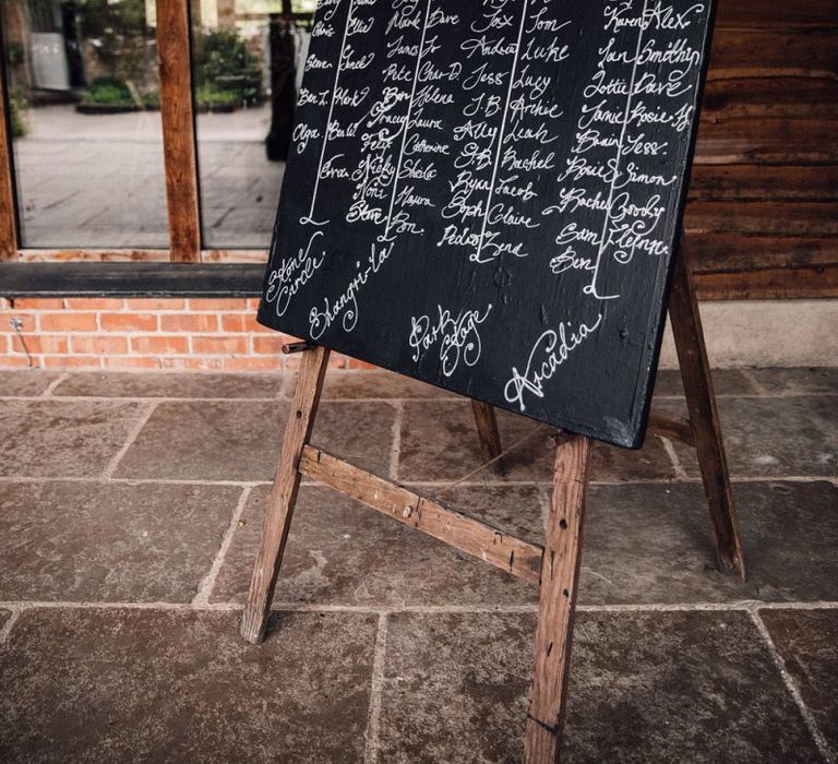 Chalkboard seating chart at Nancarrow Farm venue in Cornwall