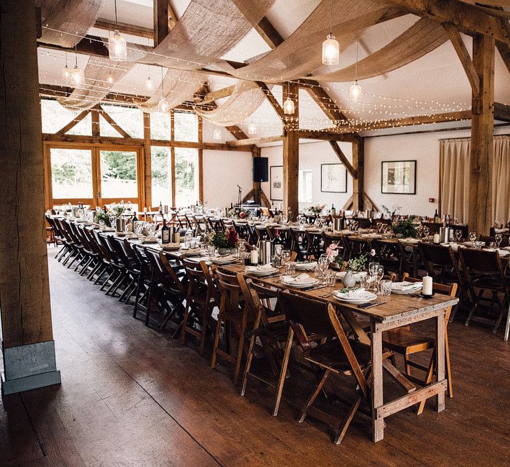 Barn wedding table set up with fairy lights