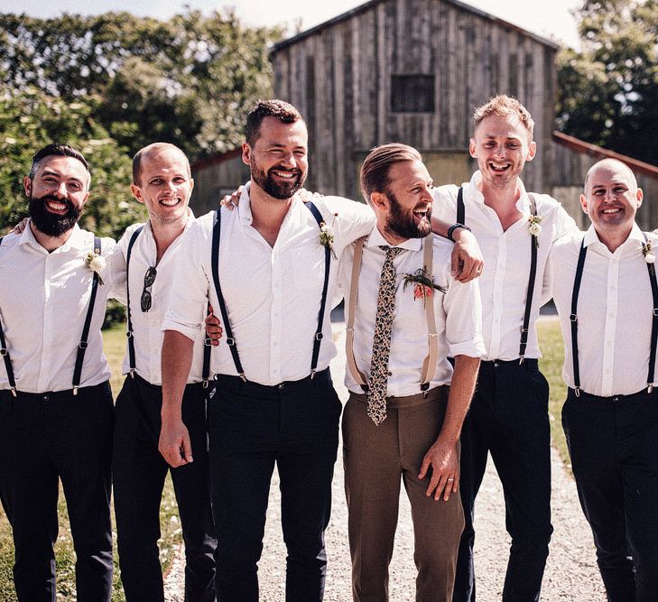 Groomsmen in matching outfits with braces