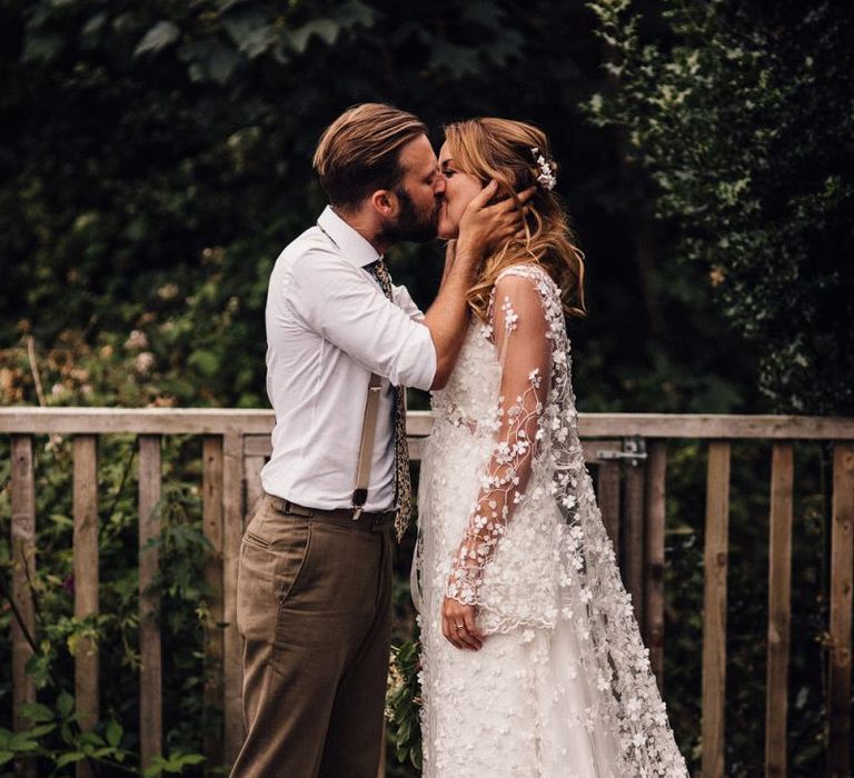 Bride in two layer bride dress with appliqué detail