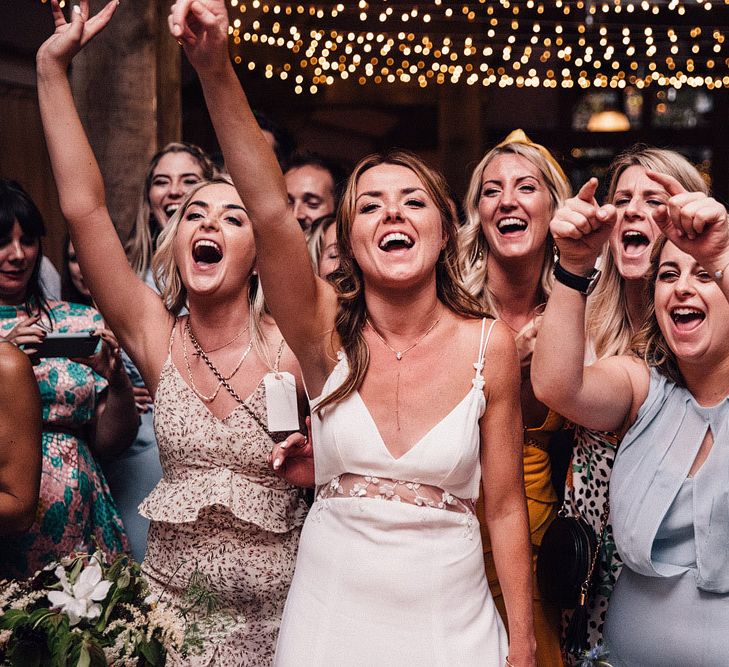 Bride with guests enjoying wedding entertainment